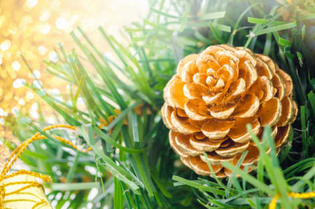 Gold Christmas background of de-focused lights with decorated treeの写真素材