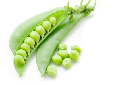 fresh green peas isolated on a white backgroundの写真素材