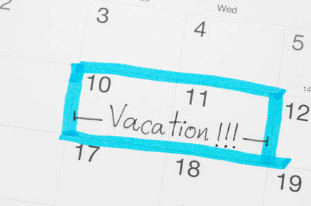 Vacation plan written on calendarの写真素材
