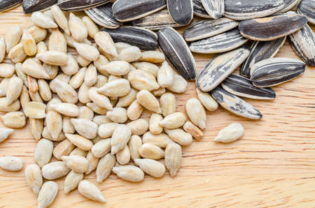 Sunflower seeds on wooden background.の写真素材