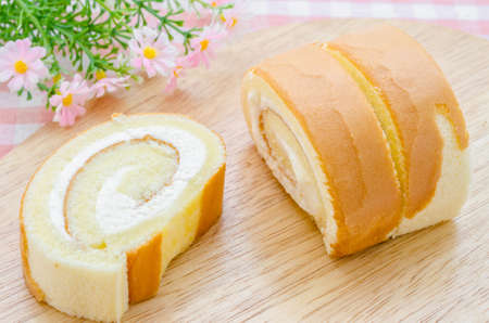 sweet sponge roll dessert on tablecloth.の写真素材