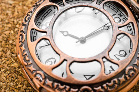 Vintage pocket watch on wood table.の写真素材