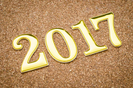 2017 Gold number on wooden background.の写真素材
