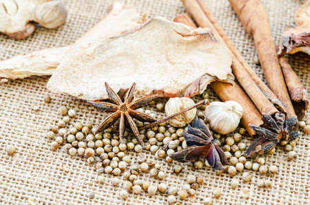 Various spices on sack background.の写真素材