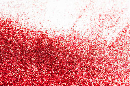 Red glitter texture on white backgroundの写真素材