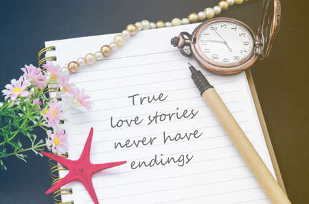 True love stories never have endings handwriting on diary note with vintage pocket watch in filter.の写真素材