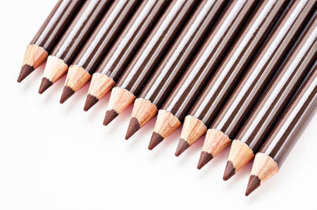 Many brown eyebrow pencils on white background.の写真素材