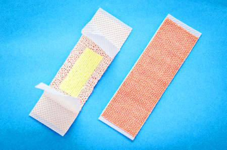 Adhesive bandage plasters set on blue background.の写真素材