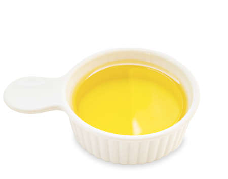 Oil vegetable for cook in white cup on whtie background. Save clipping path.の写真素材
