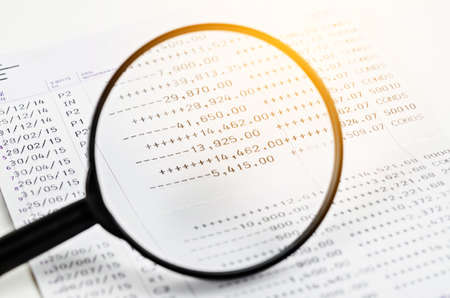Magnifier and book bank on white background.の写真素材
