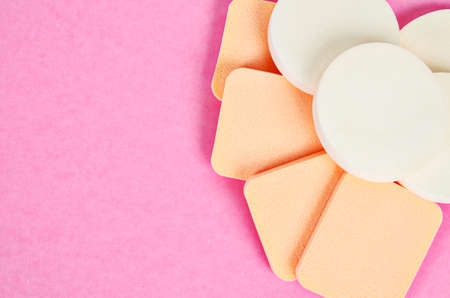 Cosmetic sponges on pink backgrpund with copyspace.の写真素材