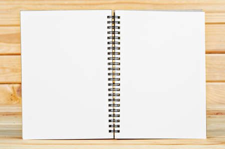 open book with blank pages on wood table