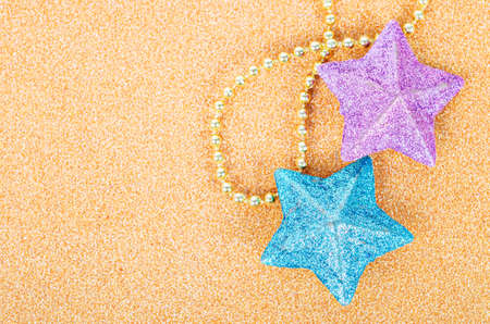 Star glitter decorate for christmas on golden background.