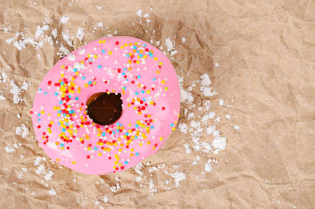 Donuts with icing on brown paper, Sweet donut.の写真素材