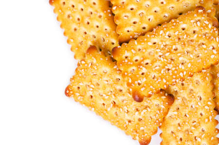 Close up crackers with white sesame seeds isolated on white background.の写真素材
