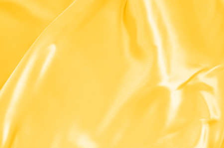gold fabric silk texture for backgroundの写真素材