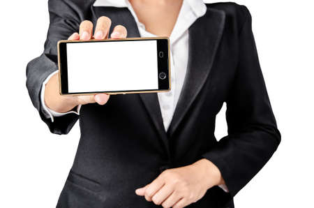 Business woman hand hold showing blank smartphone screen for your text. Isolated on a white background. Focus on smartphoneの写真素材