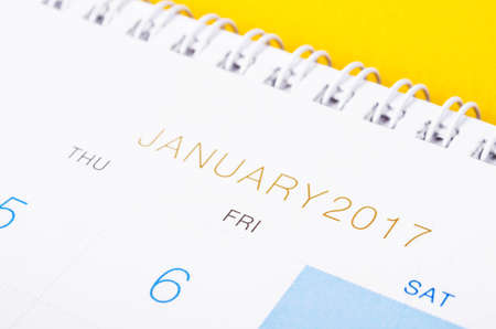 Desk top calendar January 2017 close up on yellow background.の写真素材
