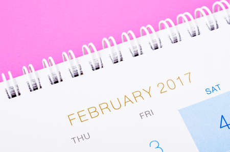 Close up February 2017 calendar page on pink background.の写真素材