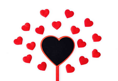 Blank wooden heart shaped tag for your text or message with red heart isolated on white background.の写真素材