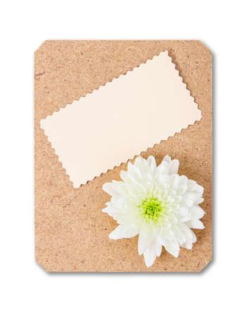 Blank paper card on wooden board with flower isolated on white background, Save clipping path.の写真素材