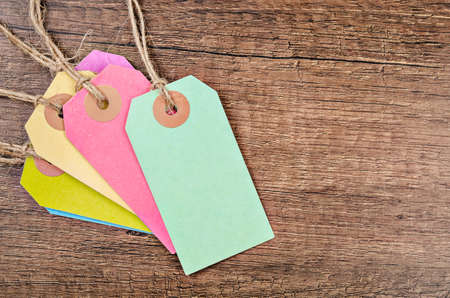 colorful of price tag or labels on the wooden background.の写真素材