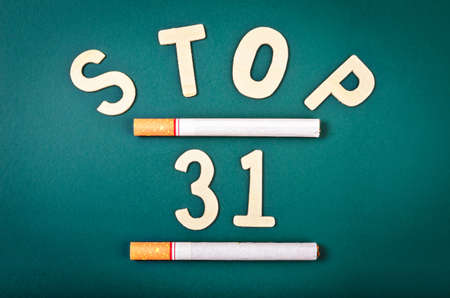 Green board with text inside "Stop 31th May" with tobaccos. Concept World No Tobacco Day.の写真素材