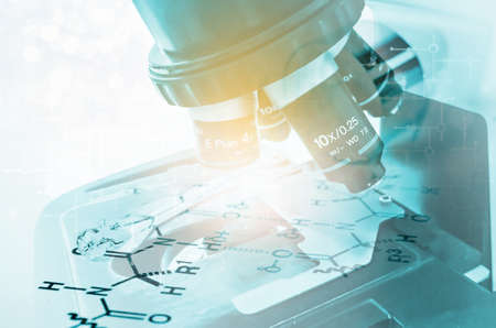 Laboratory Microscope. Scientific and healthcare research background Double exposure laboratory glass Pipette on Chemical formula paper with light tone select focusの写真素材