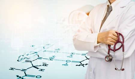 Doctor holding stethoscope on Laboratory glass Pipette on Chemical formula paper with light tone background.の写真素材
