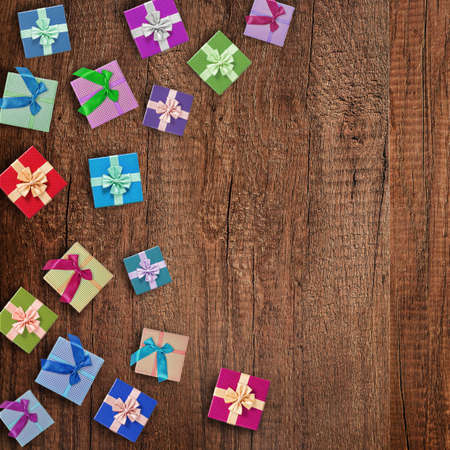 Beautiful gift box on old wooden background with empty space for your text or message.の写真素材