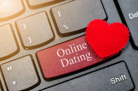 concepts of online dating, with message on enter key of keyboard.の写真素材