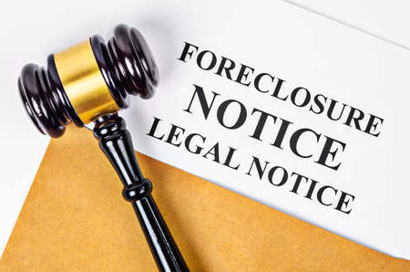 Gavel and Foreclosure Notice document on white background.