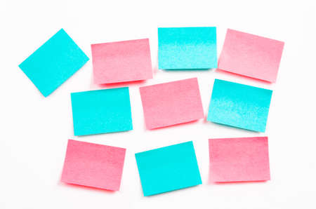 Blank post it notes or sticky note on white wall.