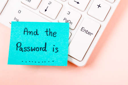 And the password is text on sticky note. with white computer keyboard.の写真素材
