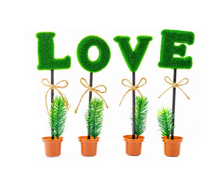 Alphabet of love in artificial tree isolated on white backgroundの写真素材