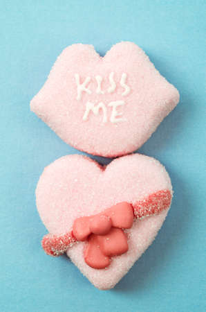 Heart-shaped Valentines candies with KISS ME text