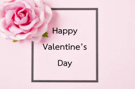 Happy valentines day against card with rose.の写真素材