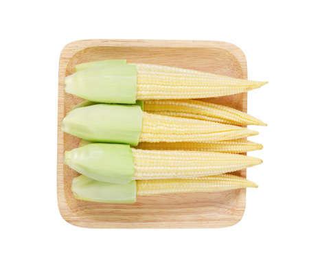 Young corn in wooden dish isolated on white background, Save clipping path.の写真素材