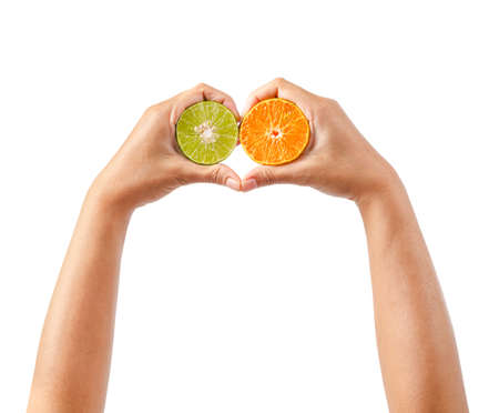 Two hand holding orange and lime fruits isolated on white background, Clipping path.の写真素材