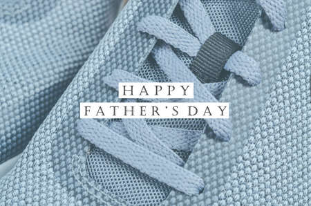 Happy Father's Day message with grey sneakers. Father's day concept.
