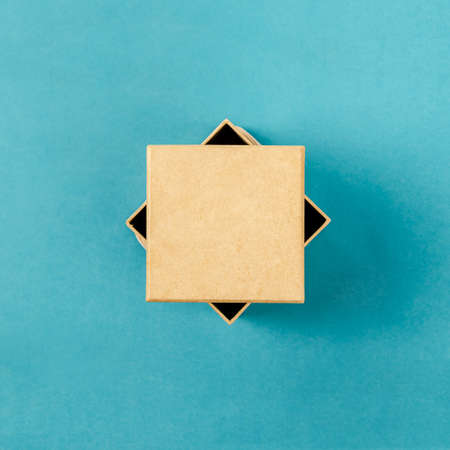 Top view of a present box package isolated on blueの写真素材