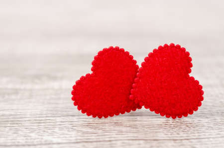 Valentines Day  with twin red heart on old wooden