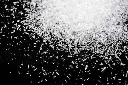 Close up Monosodium glutamate, MSG on black background.の写真素材