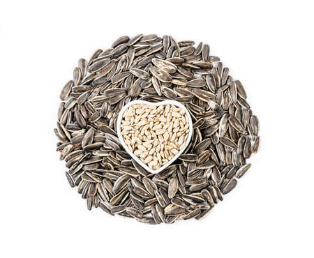 pile of sunflower seeds isolated on white background.の写真素材