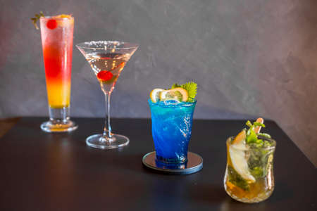 Colourful of many cocktail in wine glass on table in bar.の写真素材