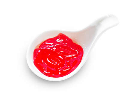Classic Strawberry Jam in white spoon isolated on a White Background, Save clipping path.の写真素材