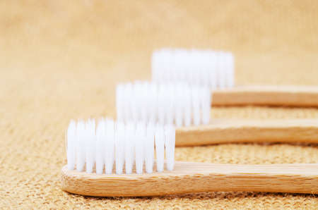 Bamboo toothbrushes on sack backgroud.