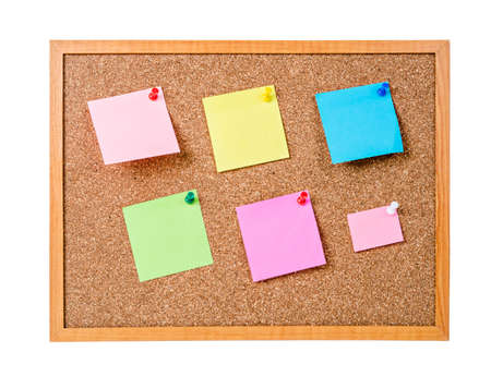 Blank sticky notes pinned on cork memo board isolated on white