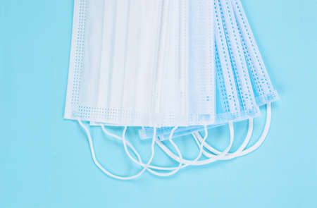 Medical mask or surgical mask with rubber ear straps. Typical 3-ply surgical mask to cover the mouth...