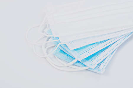 Medical mask or surgical mask with rubber ear straps. Typical 3-ply surgical mask to cover the mouth...